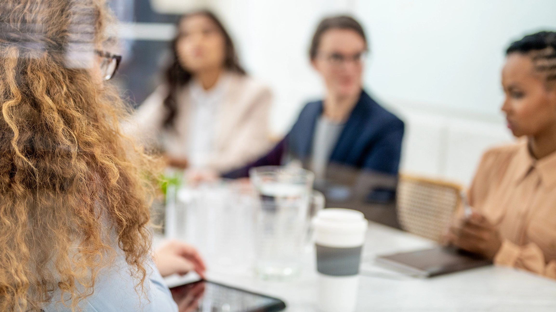 Professionals in a compliance planning meeting